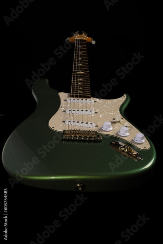 Stratocaster style electric guitar floating on black background