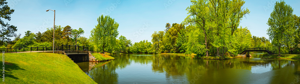Tranquil spring landscape along the riverbank of Roosevelt Lake at Roger Williams Park, Providence, Rhode Island
