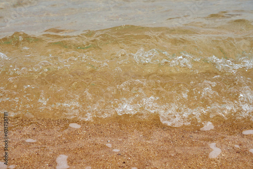 Sea water on the sandy shore.