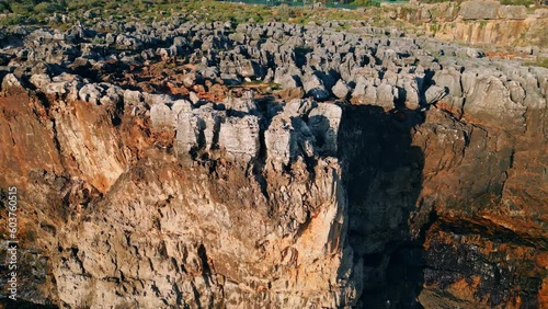 Drone rough stony rocks under summer sunlight. Dangerous cliff rugger stones. photo
