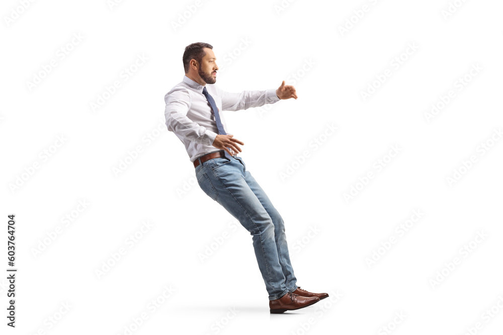 Full length profile shot of a man falling