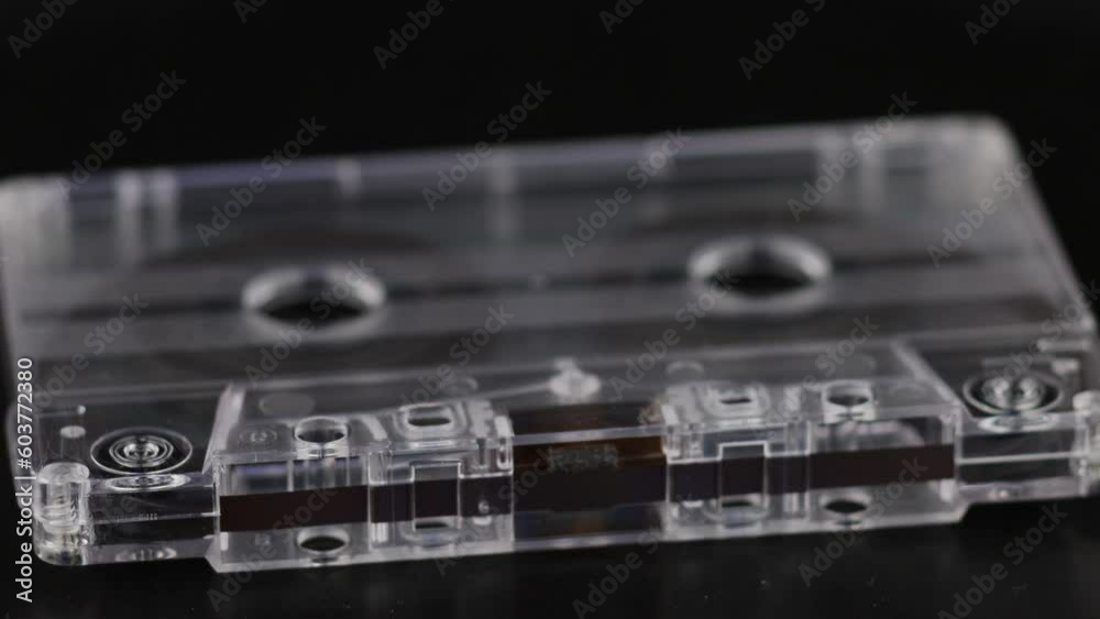 Audio cassette with magnetic tape close-up. Audio cassette with magnetic tape close-up.