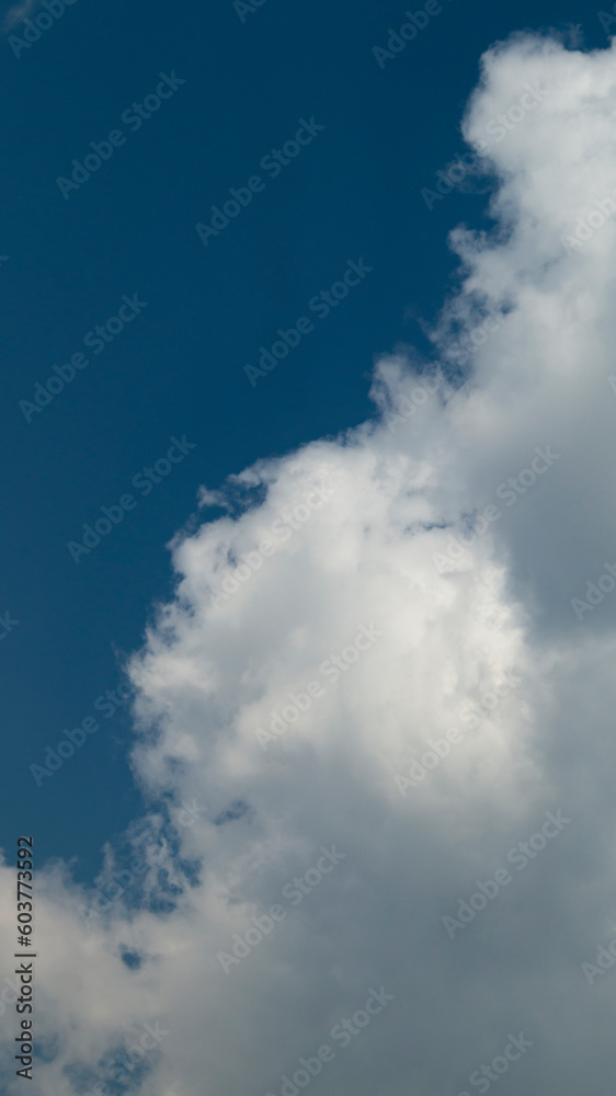 Blue sky with white clouds. Blue sky with white clouds close-up. White clouds on a sunny day Blue sky with white clouds. Blue sky with white clouds close-up. White clouds on a sunny day