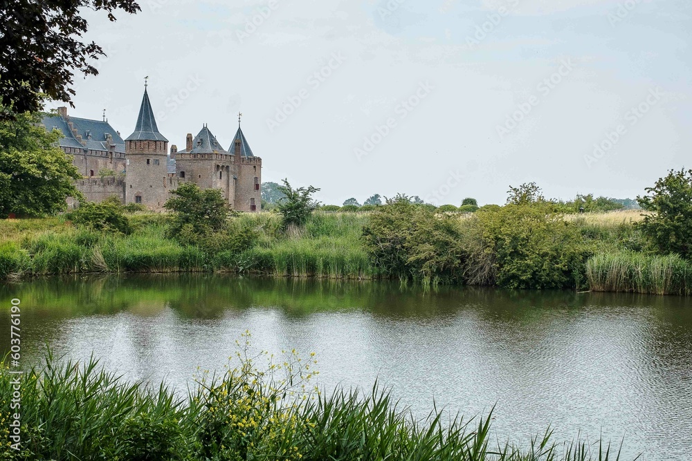 Naklejka premium Castle near Amsterdam called Muiderslot. A 15th century building and a landmark