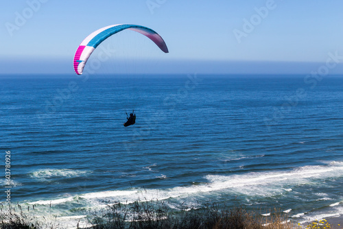 Paragliding flight over the Pacific coastline © Victoria