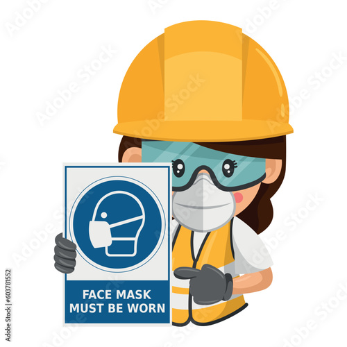 Industrial woman construction worker with a warning sign for the mandatory use of a face mask. Face mask must be worn. Industrial safety and occupational health at work photo