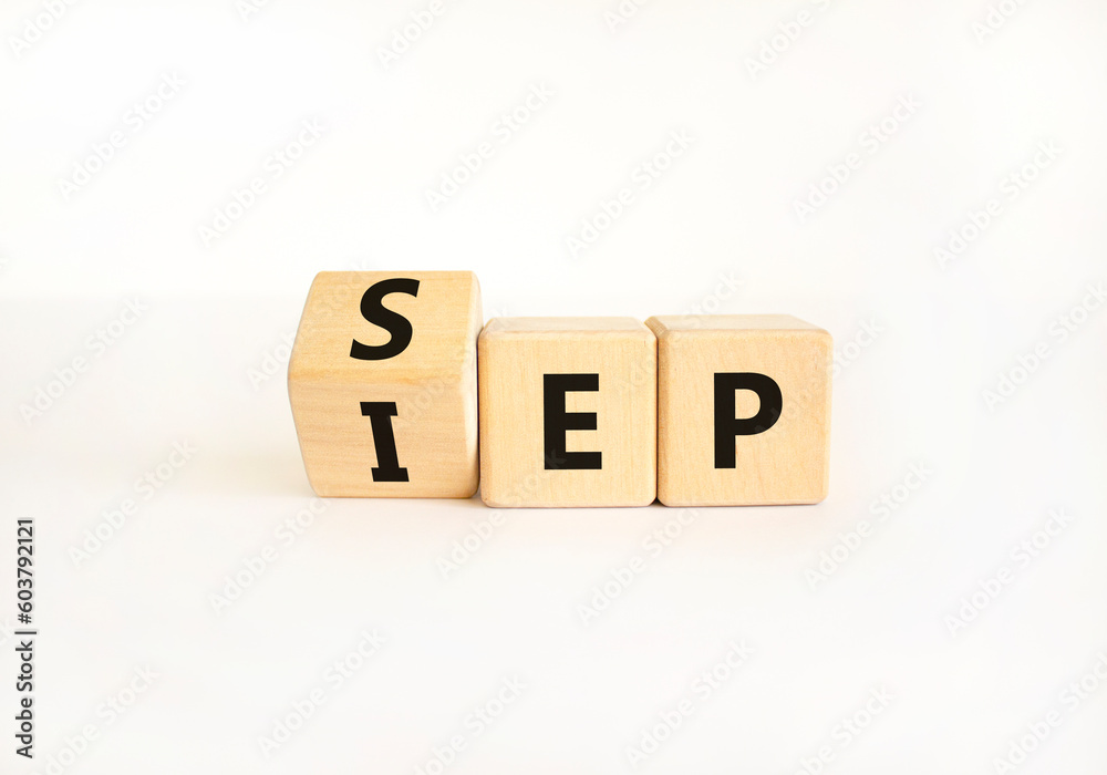 SEP or IEP symbol. Concept words IEP initial enrollment period SEP special enrollment period. Beautiful white table white background. Medical initial or special enrollment period concept. Copy space SEP or IEP symbol. Concept words IEP initial enrollment period SEP special enrollment period. Beautiful white table white background. Medical initial or special enrollment period concept. Copy space