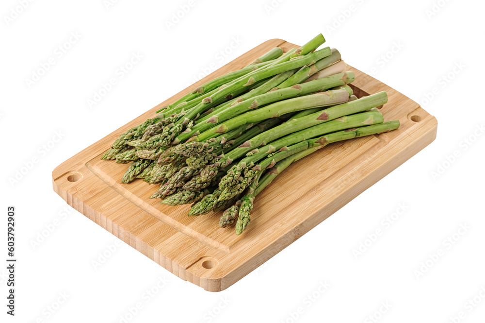 Fresh green asparagus on a wooden board. Isolated on white background Fresh green asparagus on a wooden board. Isolated on white background