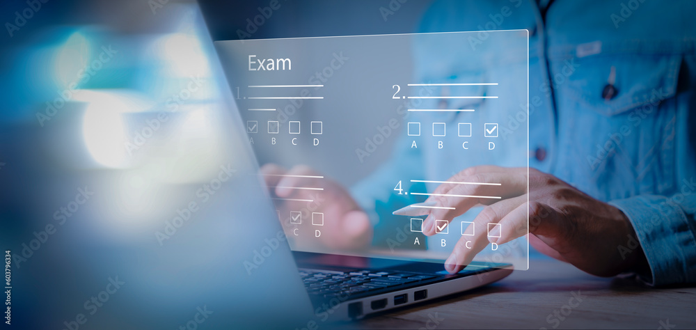 © Montri - online exam, choose correct answer in test. adult student do test examination with multiple choice. Answer the test questions. E learning technology concept. Online education,