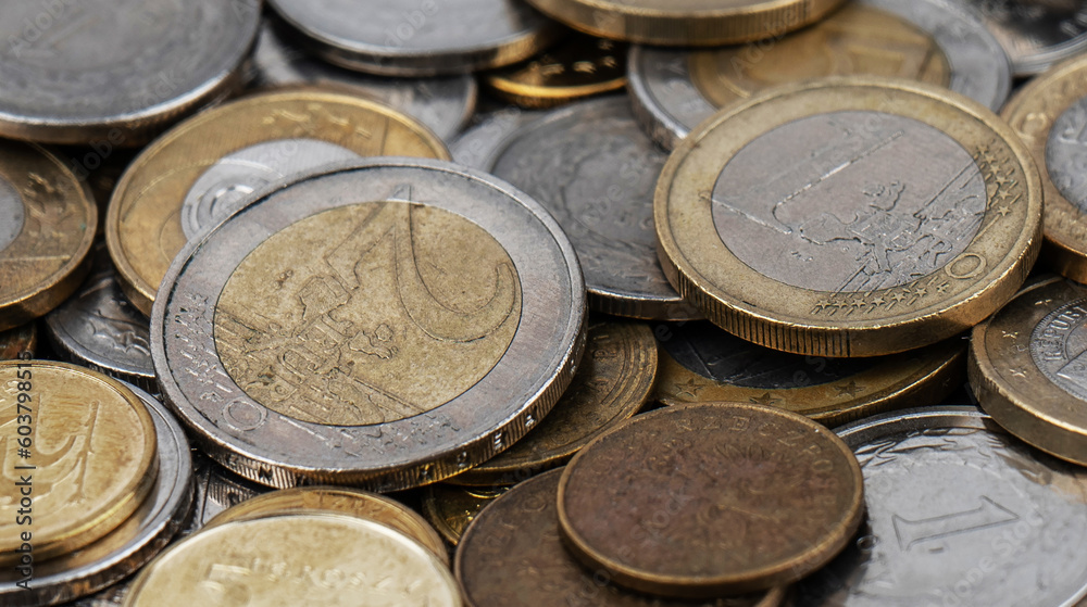 A pile of gold and silver coins. A pile of gold and silver coins.