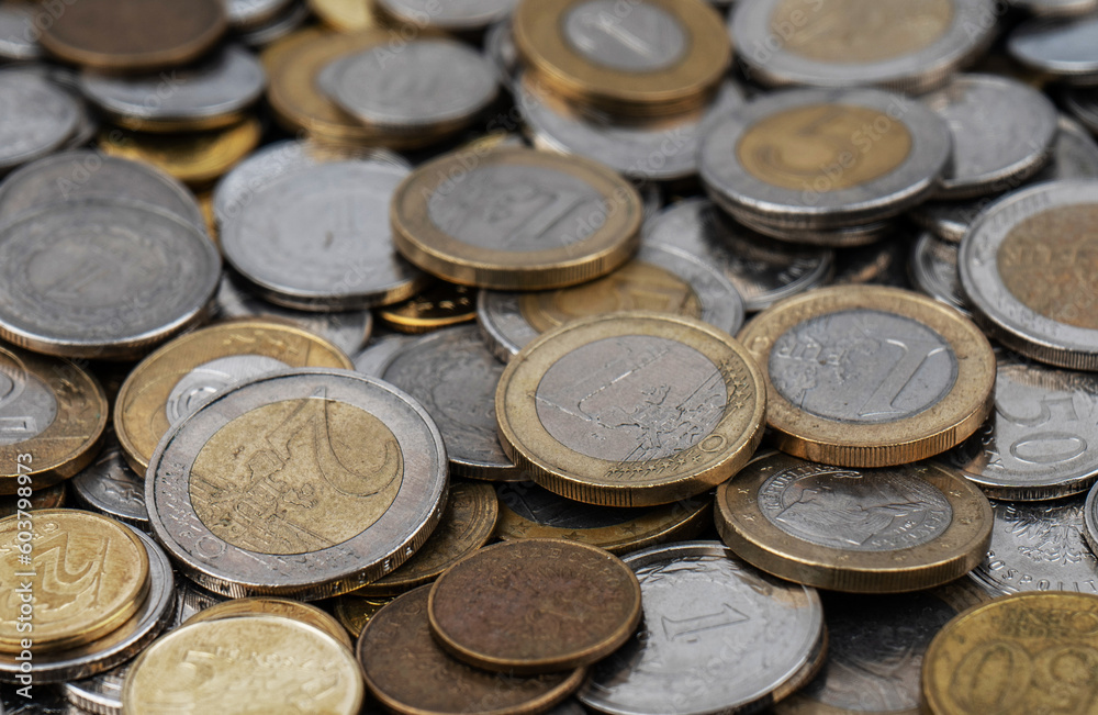 A pile of gold and silver coins. A pile of gold and silver coins.