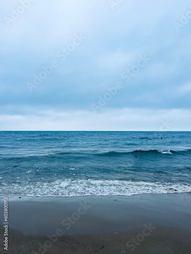 Cloudy gray seascape, sea coast, windy cloudy weather 