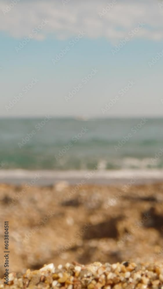 Red and green lollipop inserted in the sand. The camera pans under them Vertical. Social Media Red and green lollipop inserted in the sand. The camera pans under them Vertical. Social Media