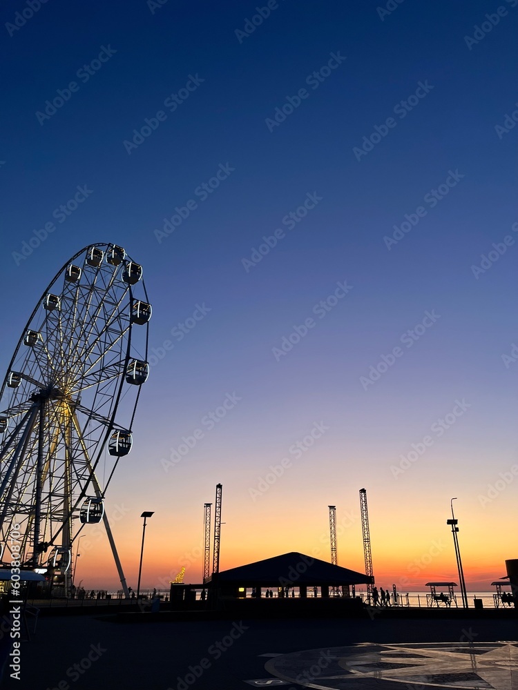 Ferris wheel at the sunset time