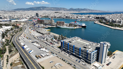 Aerial drone photo from busy port of Piraeus where passenger ships travel to Aegean destination islands, Attica, Greece © aerial-drone