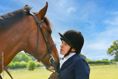 We got this, young female rider and her horse share a look into each others eyes preparing for the competition ahead, giving confidence to both horse and rider.