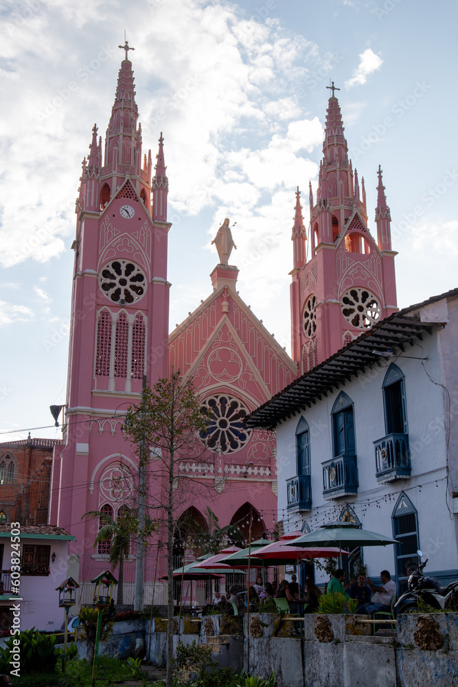 pink church in a town in latin america