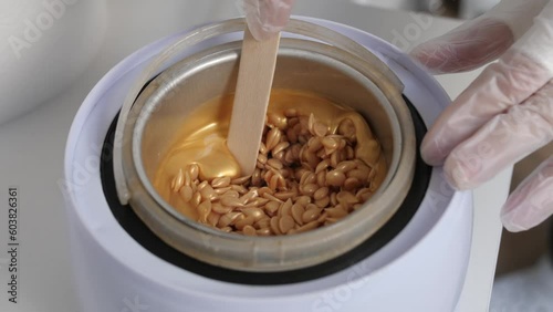 Granulated gold wax for depilation in master