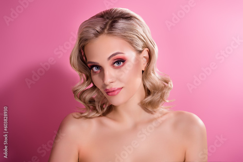 Professional studio portrait of aesthetic lady with bright make up look in camera isolated pastel color background
