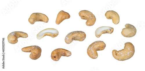 Set of whole or halved salty cashew nuts isolated on a white background. Anacardium occidentale. Closeup a group of delicious roasted cashews with salt crystals. Healthy organic seeds of kidney shape.