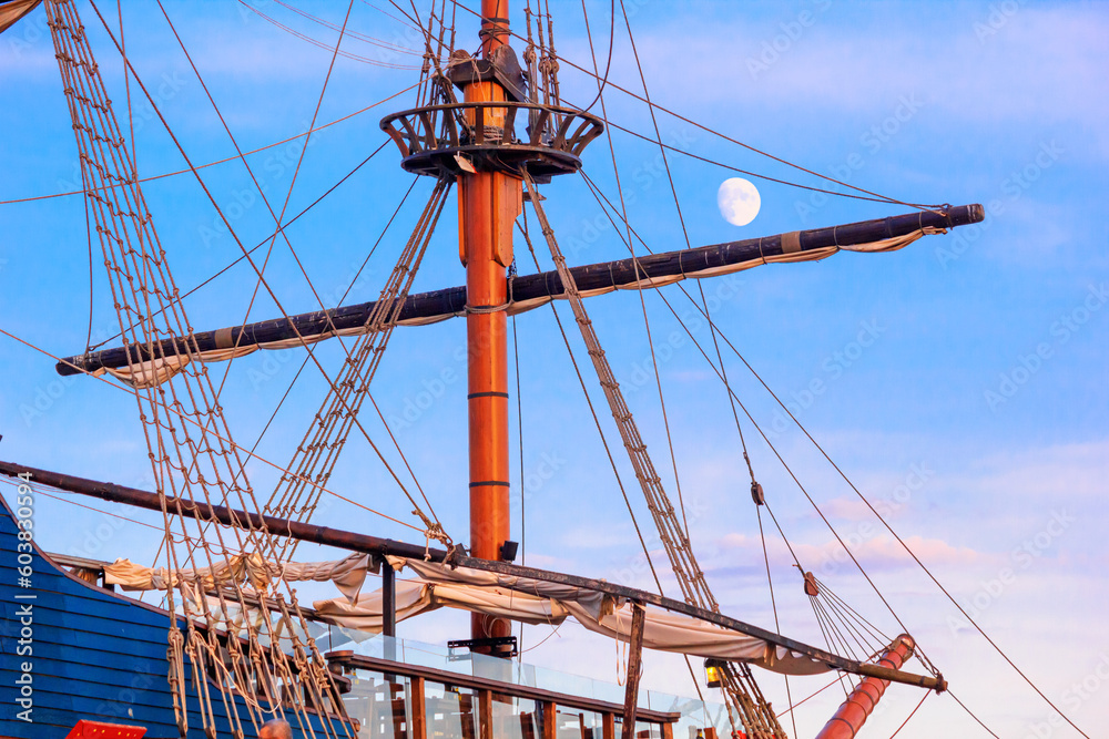 View of a sailing ship in the style of a vintage sailboat against the background of the evening sky in the port of Varna, on the Black Sea coast of Bulgaria View of a sailing ship in the style of a vintage sailboat against the background of the evening sky in the port of Varna, on the Black Sea coast of Bulgaria