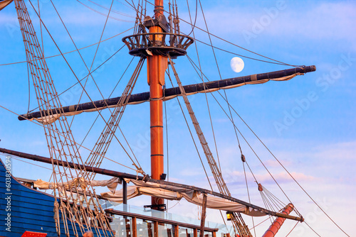 View of a sailing ship in the style of a vintage sailboat against the background of the evening sky in the port of Varna, on the Black Sea coast of Bulgaria