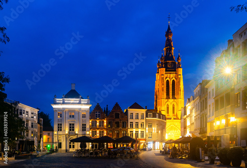 Central Square of Belgian city of Kortrijk with Gothic Saint Martins church at summer evening