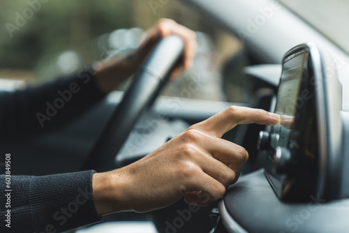 closeup shot of a man checking something on a navigation in a car, trip concept. High quality photo