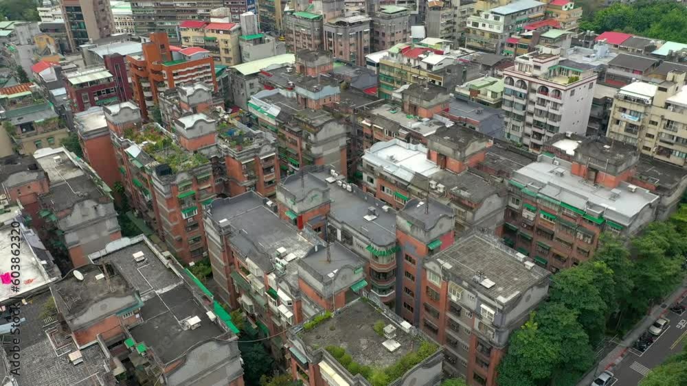 TAIWAN, TAIPEI - MAY, 2023: Aerial drone view of residential buldings surrounded by green trees park. Skyscrapers and high-rise buildings on background. TAIWAN, TAIPEI - MAY, 2023: Aerial drone view of residential buldings surrounded by green trees park. Skyscrapers and high-rise buildings on background.