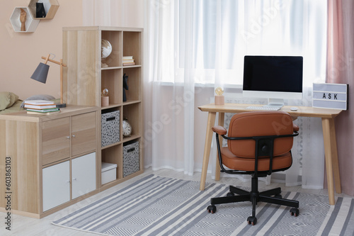 Modern teenager's room interior with stylish workplace © New Africa