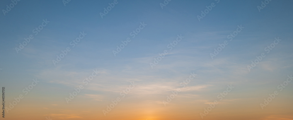 Fototapeta premium Morning sky scene with a bright golden light. Beautiful sunrise with clouds soft. Nature background concept