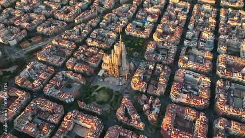 Aerial view of Barcelona Eixample residential district and famous Basilica Sagrada Familia at sunrise. Catalonia, Spain