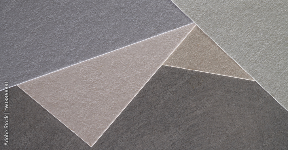 Fototapeta premium gray and light gray colored paper with texture for postcard banner background.paper of different shades of gray for banner background.gray shades paper texture