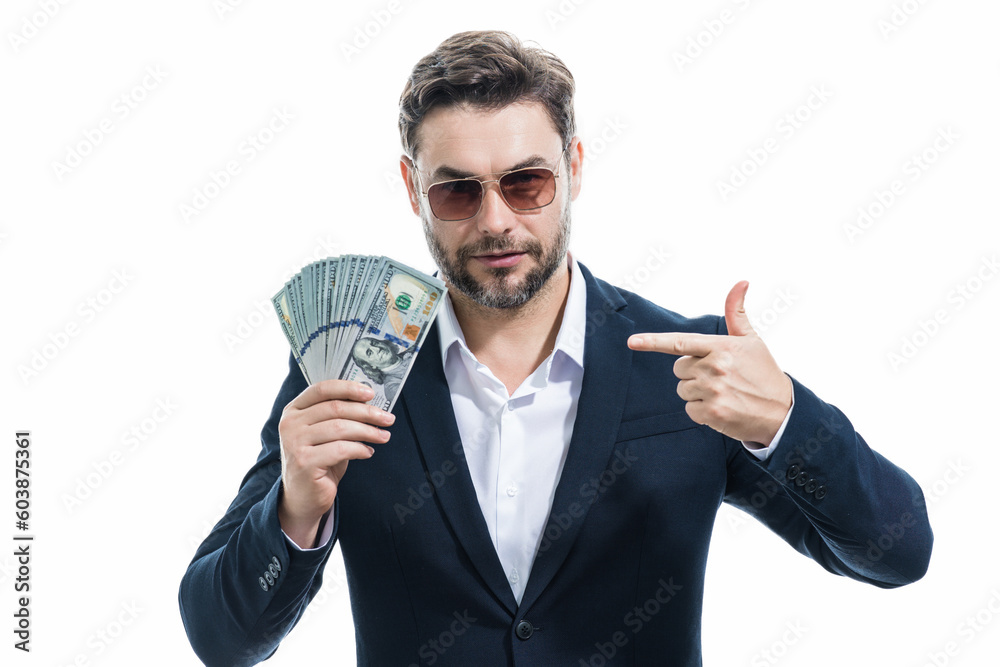 Man in suit holding cash money in dollar banknotes on isolated white background. Studio portrait of businessman with dollar banknotes. Dollar money. Career wealth business. Cash dollar concept. Man in suit holding cash money in dollar banknotes on isolated white background. Studio portrait of businessman with dollar banknotes. Dollar money. Career wealth business. Cash dollar concept.