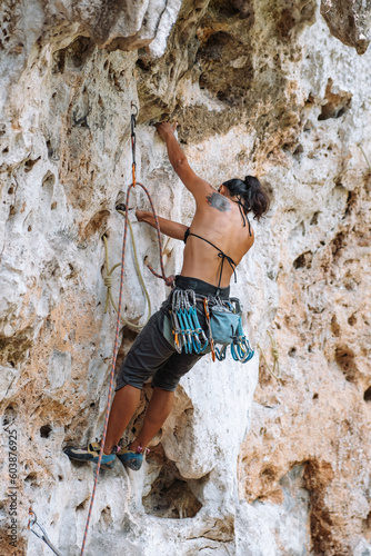 Rock-Climbing Experienced Female Climbing Mountain in Krabi, Thailand