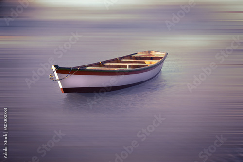 Small boat floating in the cloudy river