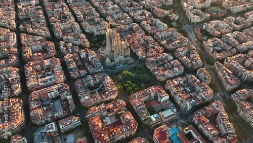 Aerial view of Barcelona Eixample residential district and famous Basilica Sagrada Familia at sunrise. Catalonia, Spain photo