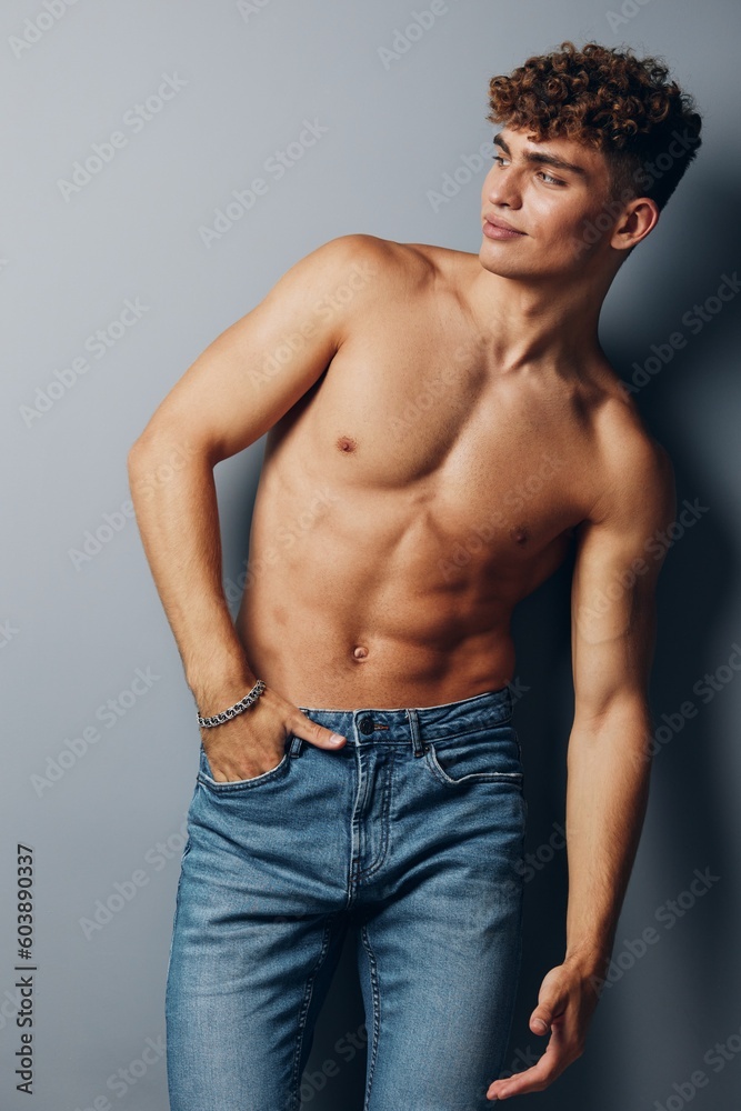 man bicep beauty bodybuilder smile fit strong studio fashion jeans person