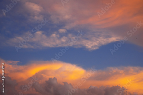 Abstract nature background. Sunset sunrise sky with yellow beautiful clouds.  © Maizal