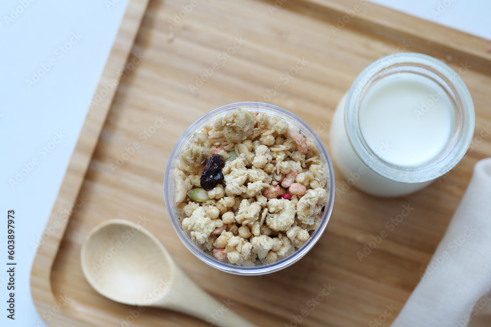 granola Musli and glass of milk on table granola Musli and glass of milk on table