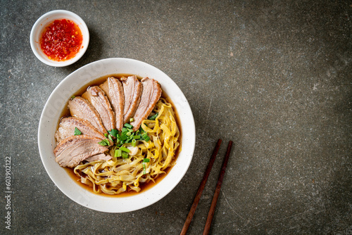 Canvas Print egg noodles with stewed duck in brown soup