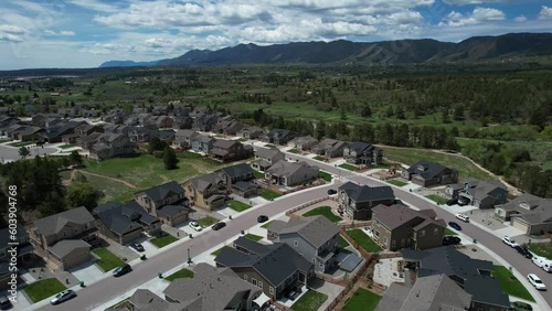 Aerial video of homes next to a lake in the mountains