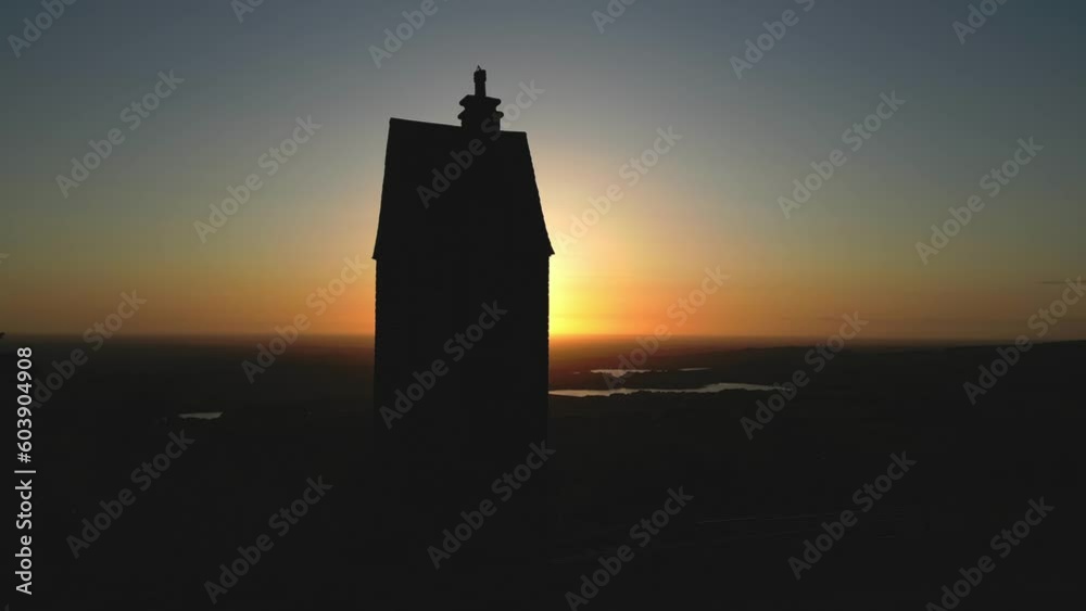 Silhouette of 19th century tower building during sunset at the Pigeon Tower, Rivington, Lancashire, UK Silhouette of 19th century tower building during sunset at the Pigeon Tower, Rivington, Lancashire, UK