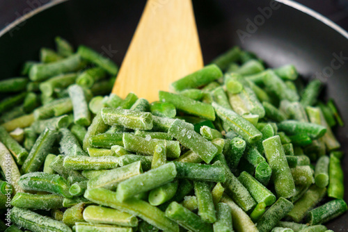 Frozen organic green beans. Healthy food concept, cooking background. Selective focus