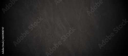 Chalkboard background Rough marble rock dark black sand wall texture material, Stone black texture background. Dark cement, concrete grunge.