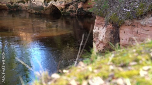 Sandstone outcrop, Jaunas Raganu klintis, in Ape, Latvia, tilt up photo