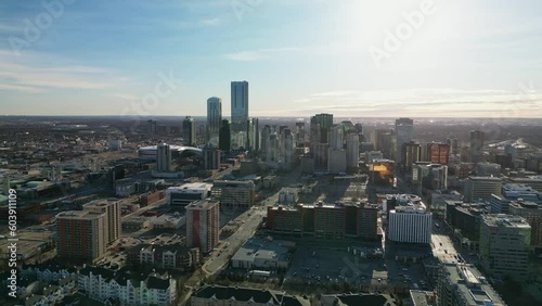 Drone reveal shot of downtown in the morning sun on a cold spring day photo