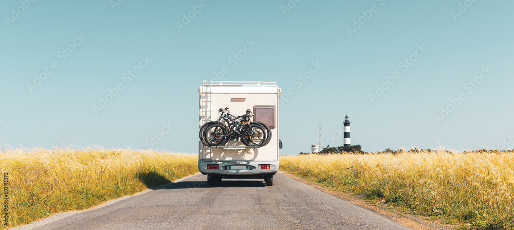 Motorhome to lighthouse Chassiron in Oleron island- travel destination, vacation, adventure, road trip concept - obrazy, fototapety, plakaty 