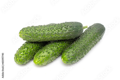 ripe cucumber with pimples on white background