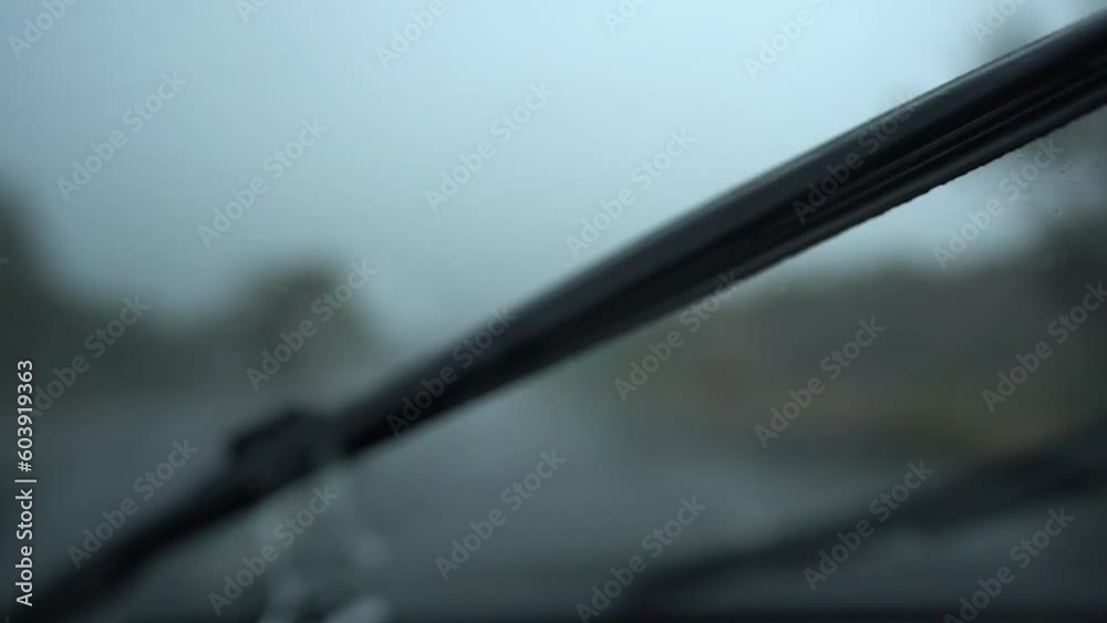 Raindrops fall on car windshield - driving Raindrops fall on car windshield - driving
